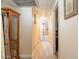 An inviting hallway with tile flooring leads to the bedrooms and bathroom at 6244 W Clouse Dr, Phoenix, AZ 85033
