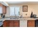 The sink looks out the window in this kitchen that is equipped with a dishwasher at 6244 W Clouse Dr, Phoenix, AZ 85033