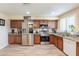 Updated kitchen with stainless steel appliances, granite countertops, and ample cabinet space at 6244 W Clouse Dr, Phoenix, AZ 85033