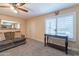 Comfortable living room with neutral walls, shuttered windows, and cozy carpeting at 6244 W Clouse Dr, Phoenix, AZ 85033