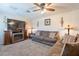 Inviting living room with stone fireplace, plush seating, and natural lighting at 6244 W Clouse Dr, Phoenix, AZ 85033