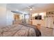 Spacious primary bedroom featuring an ensuite bathroom and ceiling fan at 6244 W Clouse Dr, Phoenix, AZ 85033