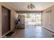 Covered patio area with stainless steel refrigerator, security gate to pool, and access to home at 6244 W Clouse Dr, Phoenix, AZ 85033