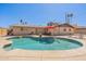 Backyard pool with beach entry, umbrellas and seating at 6244 W Clouse Dr, Phoenix, AZ 85033