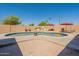 Backyard with an inground pool, outdoor grilling station, and lounge chairs at 6244 W Clouse Dr, Phoenix, AZ 85033