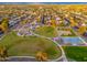Community park aerial shot, showcasing playgrounds, green spaces, and sports courts amidst residential homes at 6556 N 43Rd Ave, Glendale, AZ 85301
