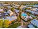 Aerial view of a sprawling, lush, well maintained community with mature trees, a pool and shuffleboard courts at 6556 N 43Rd Ave, Glendale, AZ 85301