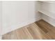 Walk in pantry with white shelves and hardwood floors at 6556 N 43Rd Ave, Glendale, AZ 85301