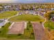 Aerial view of neighborhood park with volleyball and playground, blending recreation with community living at 6556 N 43Rd Ave, Glendale, AZ 85301
