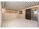View of the covered back patio with security door and concrete flooring at 6556 N 43Rd Ave, Glendale, AZ 85301