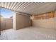 View of the covered back patio with storage and concrete flooring at 6556 N 43Rd Ave, Glendale, AZ 85301