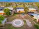 Aerial view of a Gathering friendly community park with a playground, basketball court and walking paths with shade trees at 6556 N 43Rd Ave, Glendale, AZ 85301
