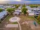 Aerial view of a well maintained playground and basketball court in a Gathering friendly community with tree lined street at 6556 N 43Rd Ave, Glendale, AZ 85301