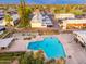 Aerial view of a large blue community pool with multiple residents swimming in it and enjoying themselves during the day at 6556 N 43Rd Ave, Glendale, AZ 85301