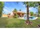 Well-maintained backyard with refreshing pool, patio, and lush greenery at 6611 E Voltaire Ave, Scottsdale, AZ 85254