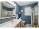 Bathroom with sleek vanity, framed mirror, and modern fixtures at 6611 E Voltaire Ave, Scottsdale, AZ 85254