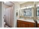 Well lit bathroom featuring vanity with a sink, and a shower with curtain at 6611 E Voltaire Ave, Scottsdale, AZ 85254