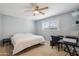 Bright bedroom featuring a fan, carpet flooring, and natural lighting at 6611 E Voltaire Ave, Scottsdale, AZ 85254