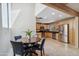 Open kitchen and dining area with stainless steel appliances and ample cabinet space at 6611 E Voltaire Ave, Scottsdale, AZ 85254