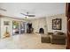 Cozy living room features a fireplace and access to the outdoor patio at 6611 E Voltaire Ave, Scottsdale, AZ 85254