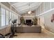Bright living room featuring vaulted ceilings, a comfortable sectional sofa, and natural light at 6611 E Voltaire Ave, Scottsdale, AZ 85254