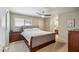 Cozy bedroom featuring a ceiling fan, neutral colors, and an ensuite bathroom at 6611 E Voltaire Ave, Scottsdale, AZ 85254