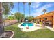 Inviting pool with diving board surrounded by lush lawn and patio area at 6611 E Voltaire Ave, Scottsdale, AZ 85254