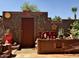 Inviting courtyard with brick accents, a door, and artistic floral decor, creating a cozy and serene outdoor space at 7423 E Cambridge Ave, Scottsdale, AZ 85257