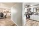 Bright kitchen featuring stainless appliances, black countertop, gray backsplash, and white cabinets at 7423 E Cambridge Ave, Scottsdale, AZ 85257