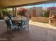 Inviting covered patio area with dining set, grill, brick accents and colorful bougainvillea at 7423 E Cambridge Ave, Scottsdale, AZ 85257