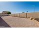This home features a xeriscaped backyard with a block wall and decorative brick bordering at 7516 W Mary Jane Ln, Peoria, AZ 85382