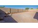The xeriscaped backyard features a decorative brick border and a block wall for privacy at 7516 W Mary Jane Ln, Peoria, AZ 85382