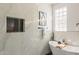 Spa-like bathroom featuring a modern soaking tub, elegant tile work, and contemporary fixtures at 7516 W Mary Jane Ln, Peoria, AZ 85382