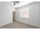 Well-lit bedroom with a ceiling fan and a window offering ample natural light, creating a serene atmosphere at 7516 W Mary Jane Ln, Peoria, AZ 85382