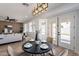 Open dining area with backyard access and view to living space, perfect for Gathering meals and entertaining guests at 7516 W Mary Jane Ln, Peoria, AZ 85382