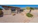 A single-story home featuring desert landscaping with a mix of rock and native plants enhancing its curb appeal at 7516 W Mary Jane Ln, Peoria, AZ 85382