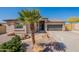 Charming single-Gathering home features a well-maintained front yard, desert landscaping, and a convenient two-car garage at 7516 W Mary Jane Ln, Peoria, AZ 85382