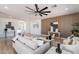 Cozy living room with hardwood floors, modern decor, and a beautiful accent wall at 7516 W Mary Jane Ln, Peoria, AZ 85382