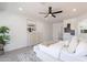 Spacious main bedroom with carpet, ceiling fan, and tasteful decor for a relaxing retreat at 7516 W Mary Jane Ln, Peoria, AZ 85382