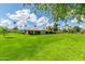 A spacious yard with green grass and mature trees providing plenty of shade and privacy at 7646 E Miami Rd, Scottsdale, AZ 85258
