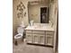 Well-lit bathroom vanity featuring decorative accents and a large mirror at 7646 E Miami Rd, Scottsdale, AZ 85258