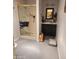 The bathroom features a tiled walk-in shower with a gold frame and a dark vanity at 7646 E Miami Rd, Scottsdale, AZ 85258