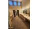 A spacious bathroom features double sinks, ample counter space, and multiple closets for storage at 7646 E Miami Rd, Scottsdale, AZ 85258