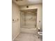 Clean bathroom featuring a bathtub with glass enclosure and modern fixtures at 7646 E Miami Rd, Scottsdale, AZ 85258