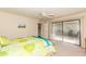 Cozy bedroom with a private patio accessible through sliding glass doors at 7646 E Miami Rd, Scottsdale, AZ 85258