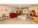 This bedroom includes a ceiling fan, a murphy bed, desk space and a comfortable recliner at 7646 E Miami Rd, Scottsdale, AZ 85258