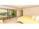 Bright bedroom featuring a sliding glass door to patio and a dedicated desk space at 7646 E Miami Rd, Scottsdale, AZ 85258