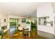Bright living room with a fireplace, open layout, and easy access to the patio and kitchen at 7646 E Miami Rd, Scottsdale, AZ 85258