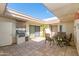 Outdoor patio with a built-in barbecue grill and comfortable seating arrangement perfect for entertaining at 7646 E Miami Rd, Scottsdale, AZ 85258