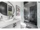 Stylish bathroom featuring hexagon tile in the shower, modern fixtures, and art on the wall at 9627 E Adobe Dr, Scottsdale, AZ 85255